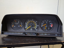 Load image into Gallery viewer, 83-93 Mercedes Benz W201 190E 6 cyl. instrument cluster 155k miles gauges tested OK
